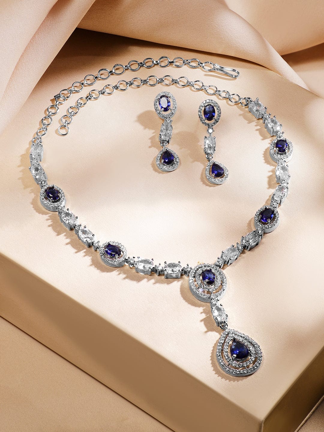 Rubans Rhodium-Plated Blue Sapphire & AAA Cubic Zirconia Studded Halo & Teardrop Design Luxe Necklace Set in Silver Tone for Women