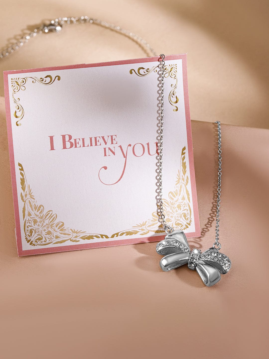 Rubans Voguish Silver Plated Stainless Steel Tarnish-Free Waterproof Bow Pendant Necklace