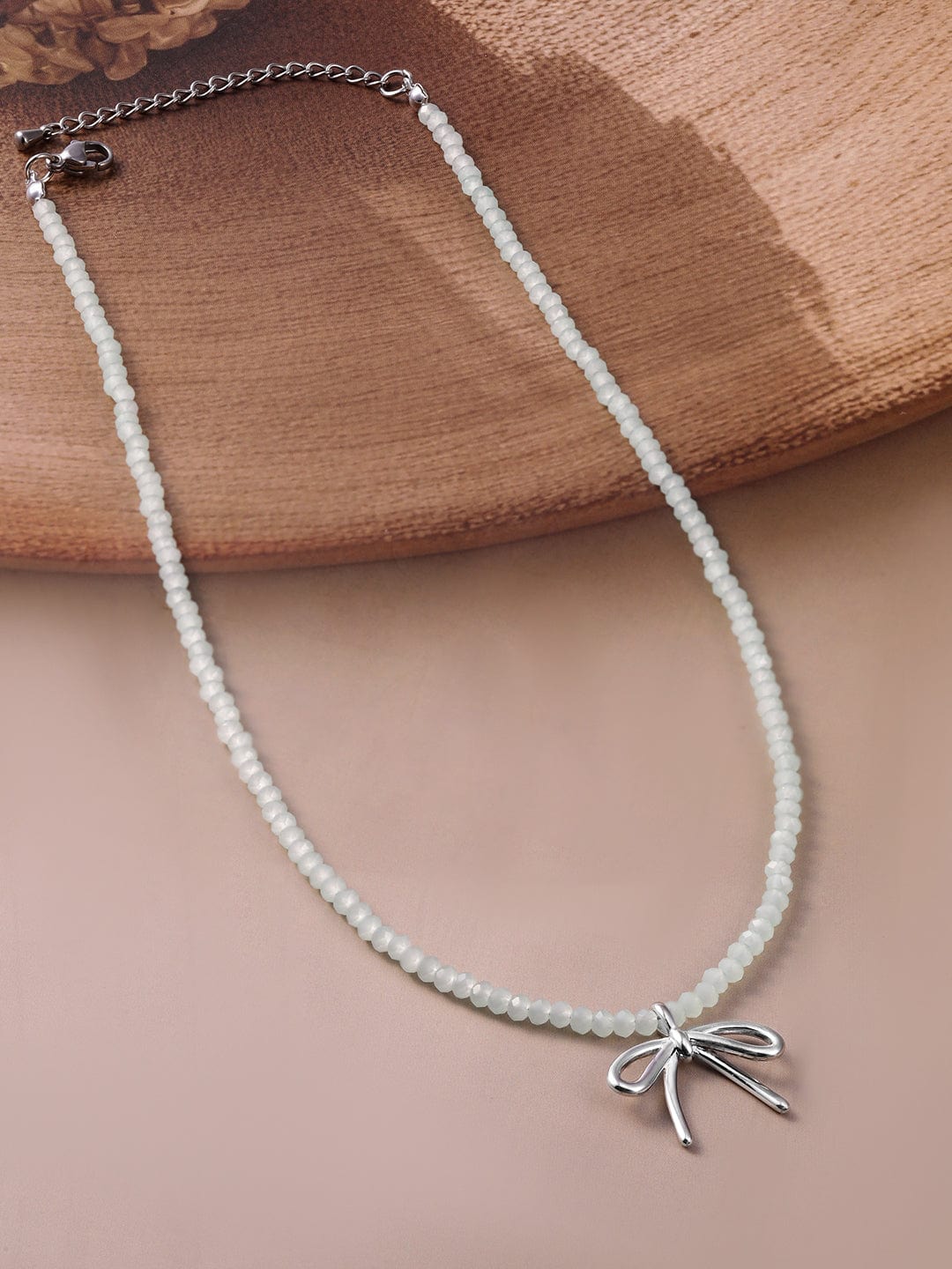 Rubans Rhodium Plated Minimalist White Beaded Necklace with Silver Bow Charm