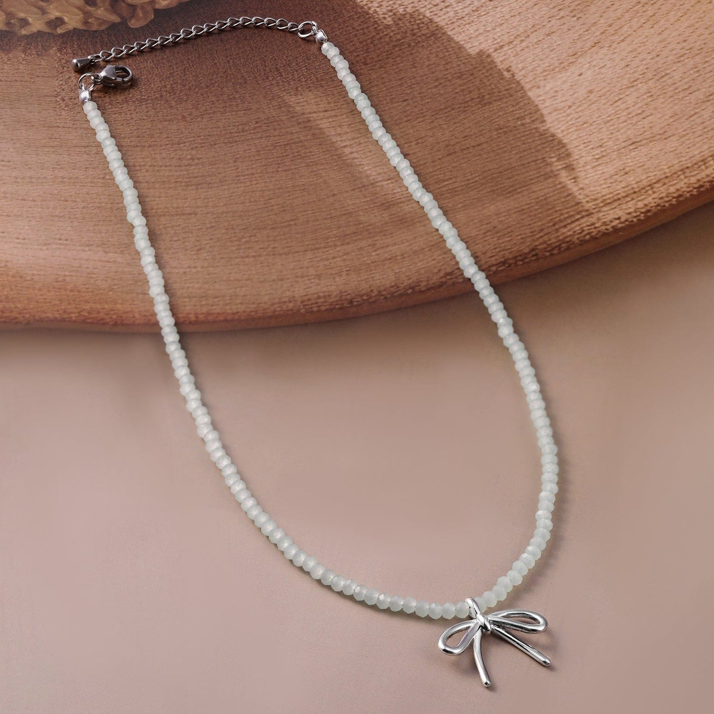 Rubans Rhodium Plated Minimalist White Beaded Necklace with Silver Bow Charm
