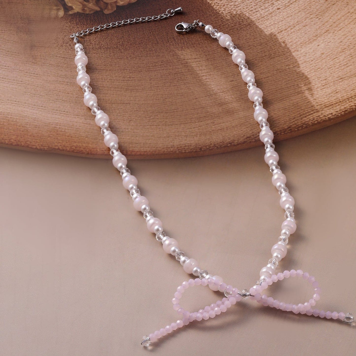 Rubans Rhodium Plated Pearl Beaded Necklace with Soft Pink Bow Charm