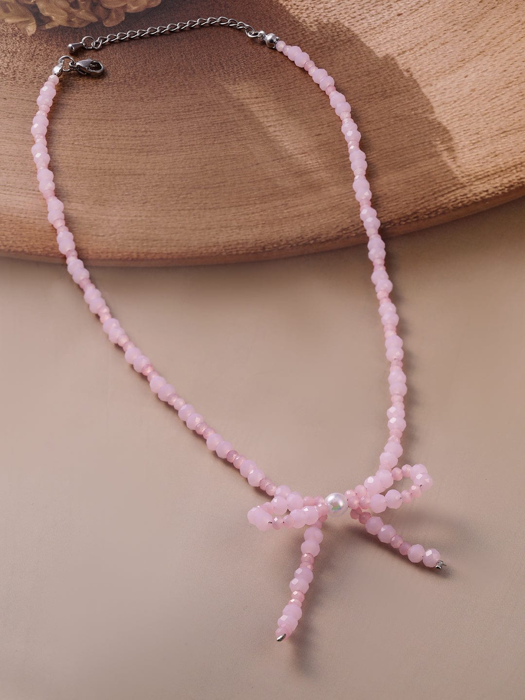 Rhodium Plated Pink Bead Necklace with Bow Pendant