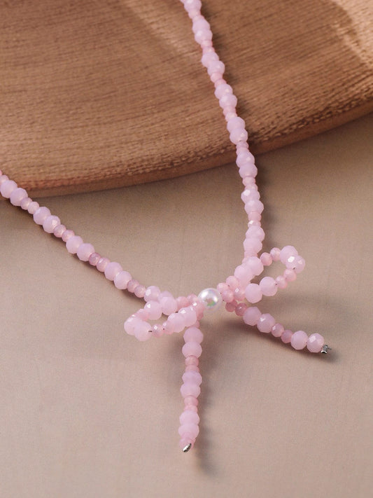 Rhodium Plated Pink Bead Necklace with Bow Pendant