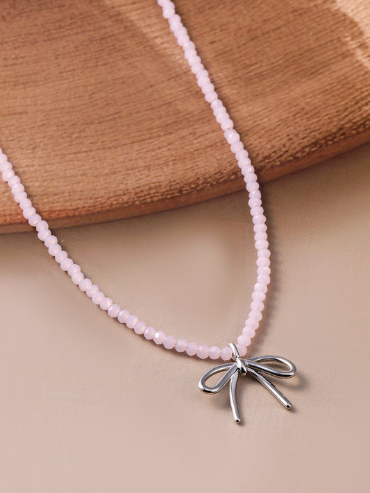 Rhodium Plated Soft Pink Beaded Necklace with Silver Bow Pendant