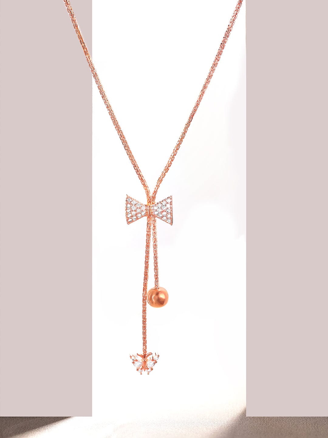 Rubans 18K Rose Gold Plated, Minimal Chain Bow Motif Zircons Studded Drop Pendant Necklace.