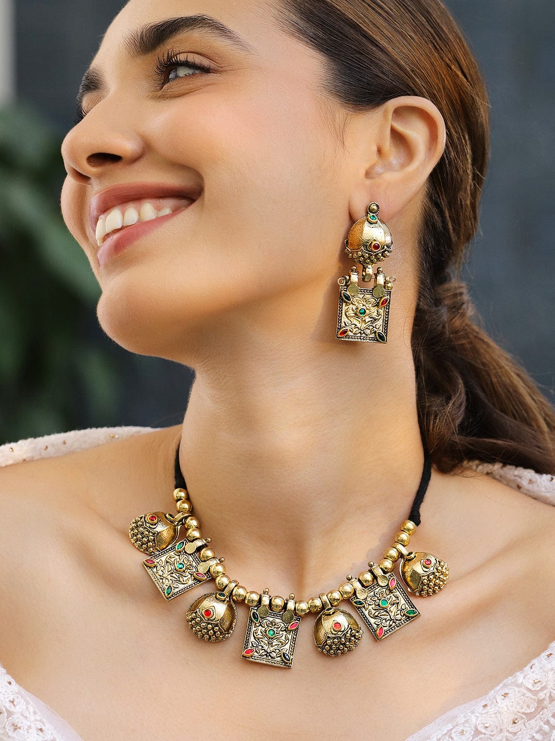 Rubans Oxidised Antique Gold-Plated Tribal Necklace Set with Dome Accents & Red-Green Stones for Women