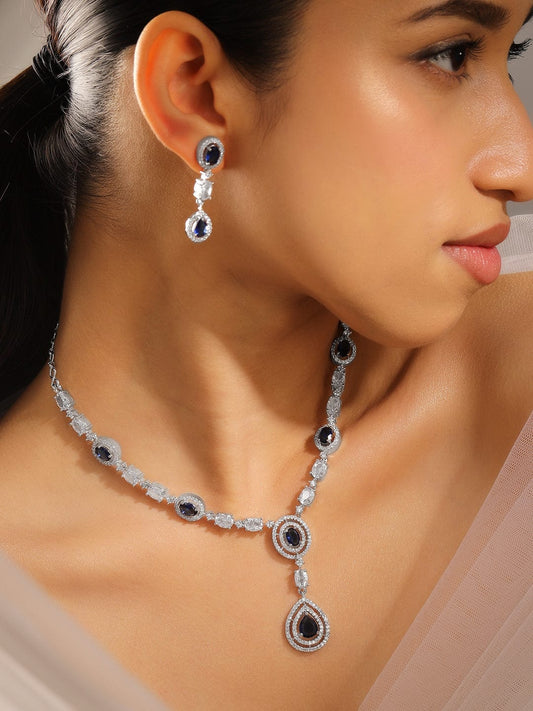 Rubans Rhodium-Plated Blue Sapphire & AAA Cubic Zirconia Studded Halo & Teardrop Design Luxe Necklace Set in Silver Tone for Women