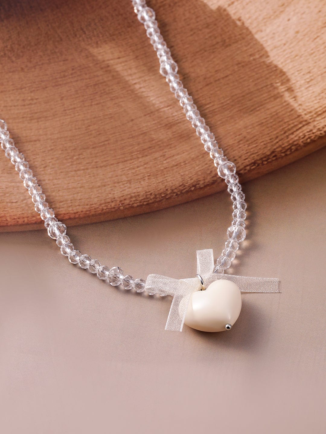 Rubans Rhodium Plated Crystal Beaded Necklace with Heart Pendant and Bow Detailing