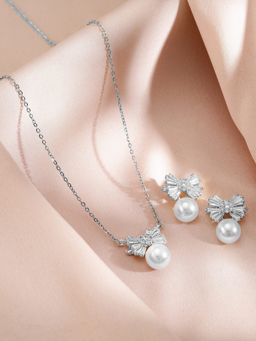 Rubans Rhodium-Plated Pearl and Crystal Bow Pendant Necklace and Earrings