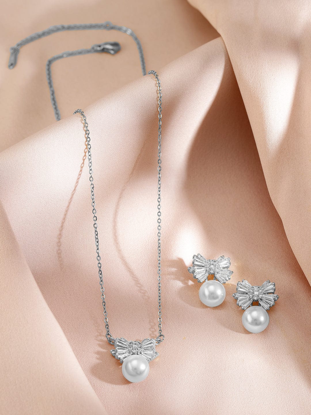 Rubans Rhodium-Plated Pearl and Crystal Bow Pendant Necklace and Earrings